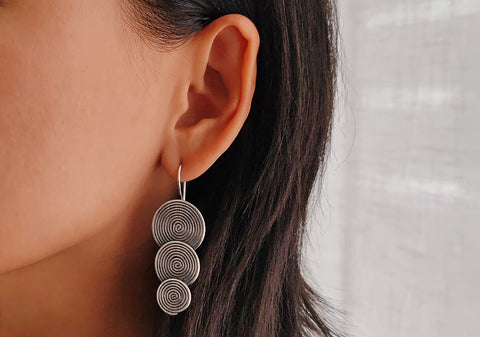 Tiered spiral disc drop earrings