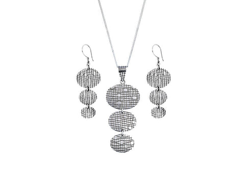 3-tier pendant necklace and earrings set from Hill to Street over a white background