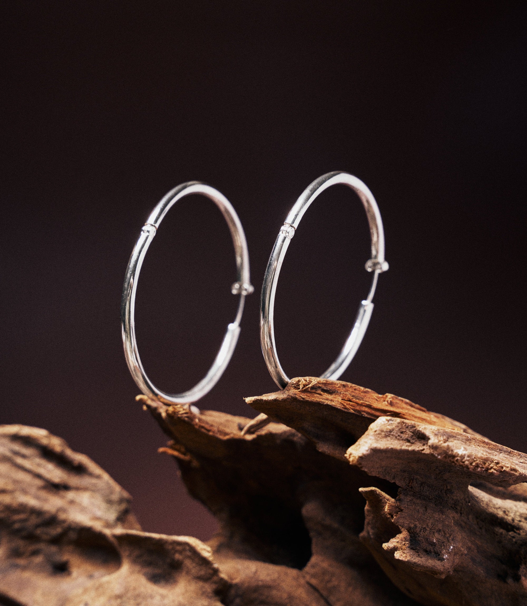 Lumi Sterling Silver 925 hoops worn with a casual outfit, styled from daytime coffee run to evening out