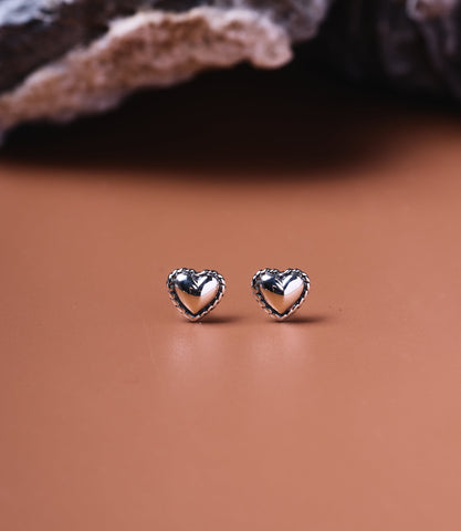 Lola Sterling Silver Heart Studs, small 925 puffed heart stud earrings with rope-twist border, front view