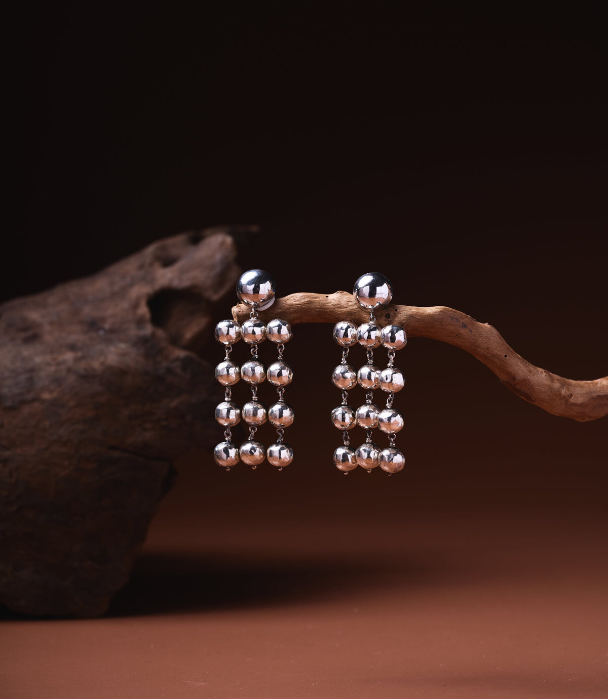 Theresa Chandelier Earrings in 925 sterling silver showing cascading hammered silver ball drops.