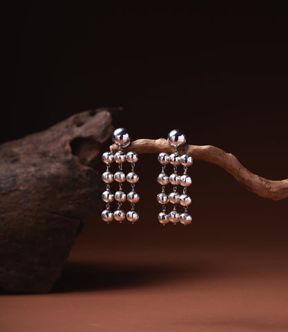 Theresa Chandelier Earrings in 925 sterling silver showing cascading hammered silver ball drops.