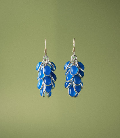 Vivia Earrings in 925 sterling silver featuring blue chalcedony oval cabochons arranged in a cascading grape-cluster drop design