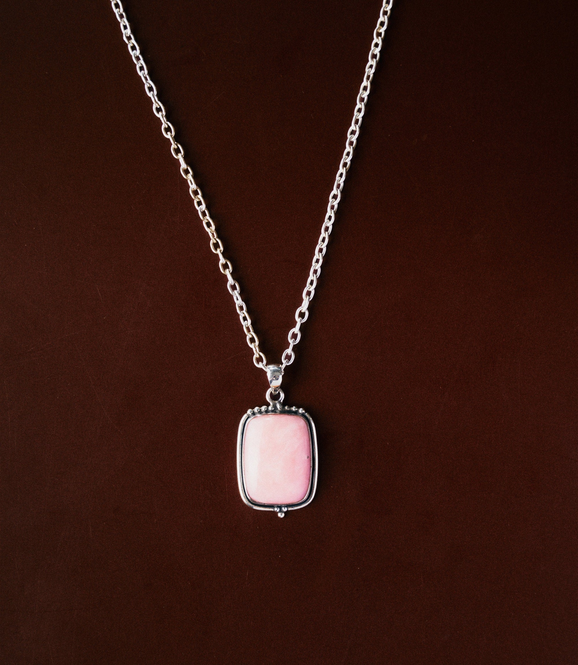 The Elodie Necklace in 925 sterling silver featuring a soft pink opal pendant with a smooth polished finish.