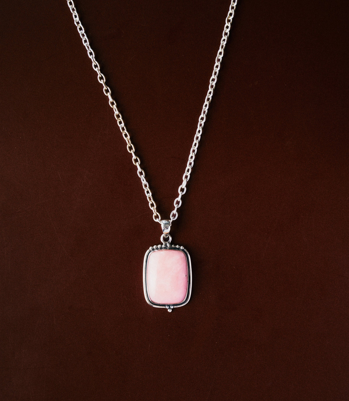The Elodie Necklace in 925 sterling silver featuring a soft pink opal pendant with a smooth polished finish.