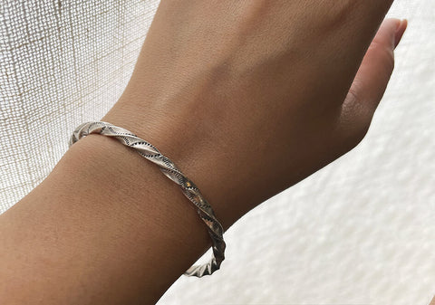 Twisted bangle with fine stamped details