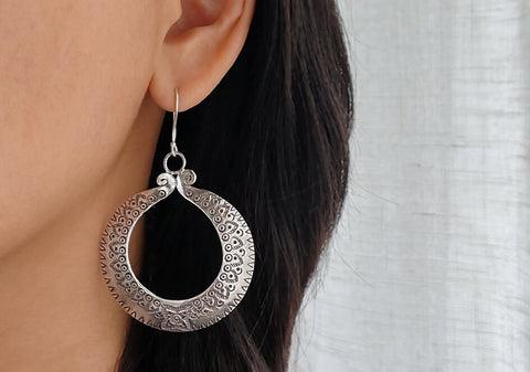 Tribal statement circular silver earrings