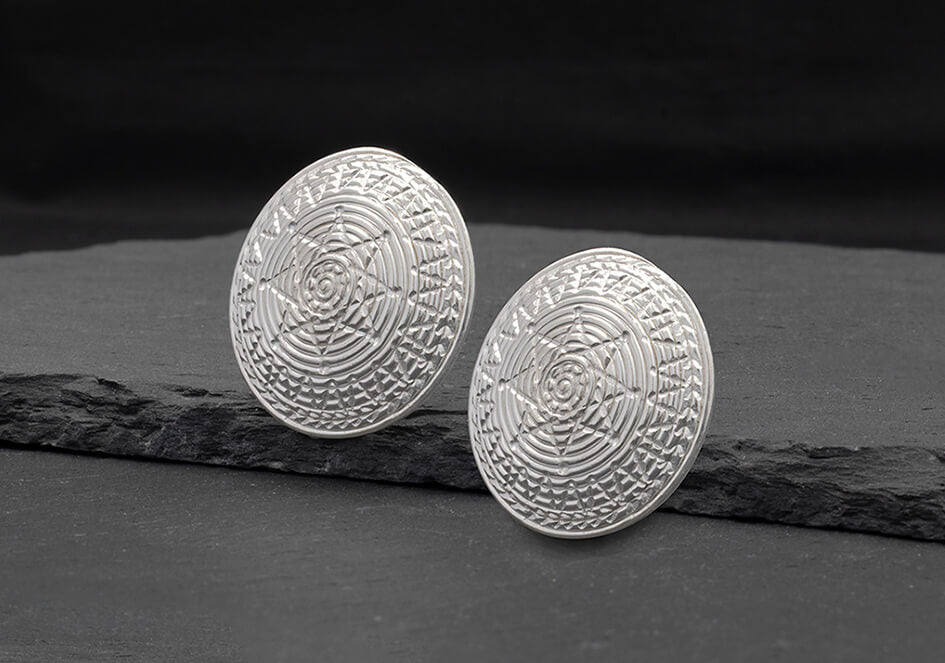 Patterned round stud silver earrings in shiny finish
