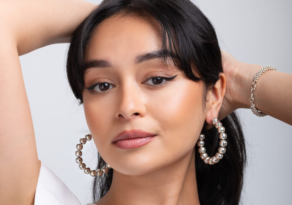 Model wearing Anna Hoop Earrings, a timeless 925 sterling silver hoop earring for everyday styling.
