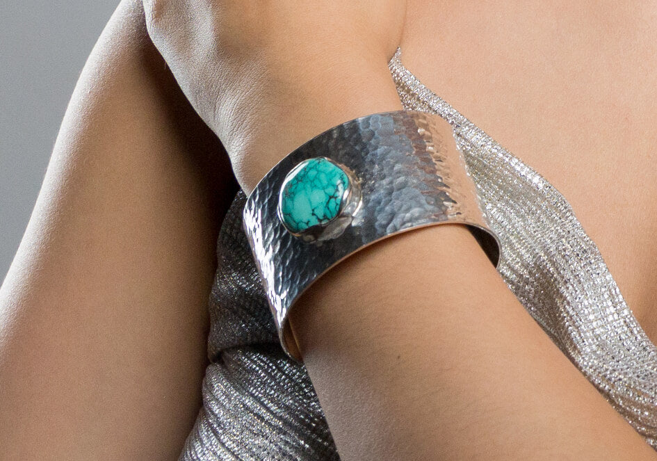 Zoomed-in photo of a chunky turquoise sterling silver cuff bangle from Hill to Street