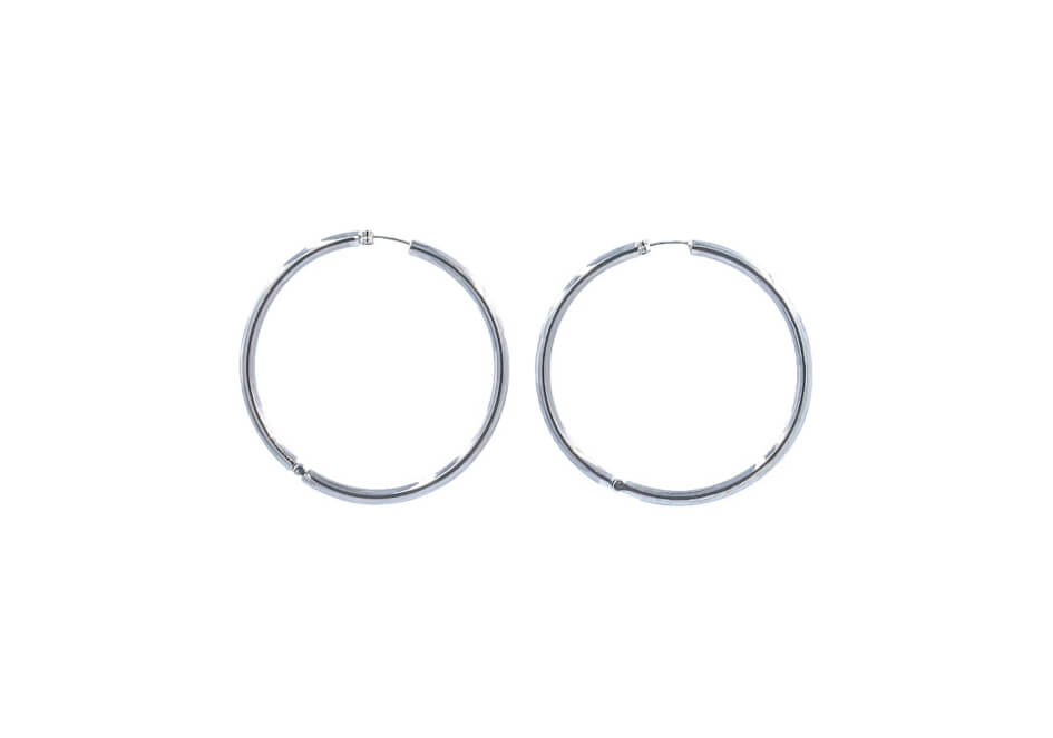 Close-up of Lumi Sterling Silver Hoops showing smooth thick hoop construction and polished 925 sterling silver finish.