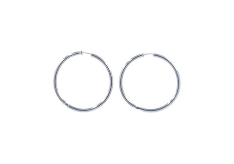 Close-up of Lumi Sterling Silver Hoops showing smooth thick hoop construction and polished 925 sterling silver finish.