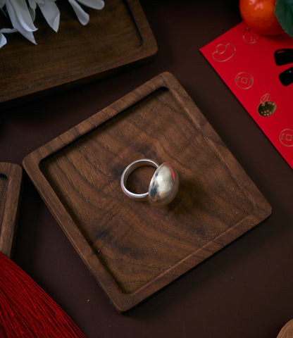 Orla Ring in pure silver showing a smooth, domed silhouette with a soft radiant finish.
