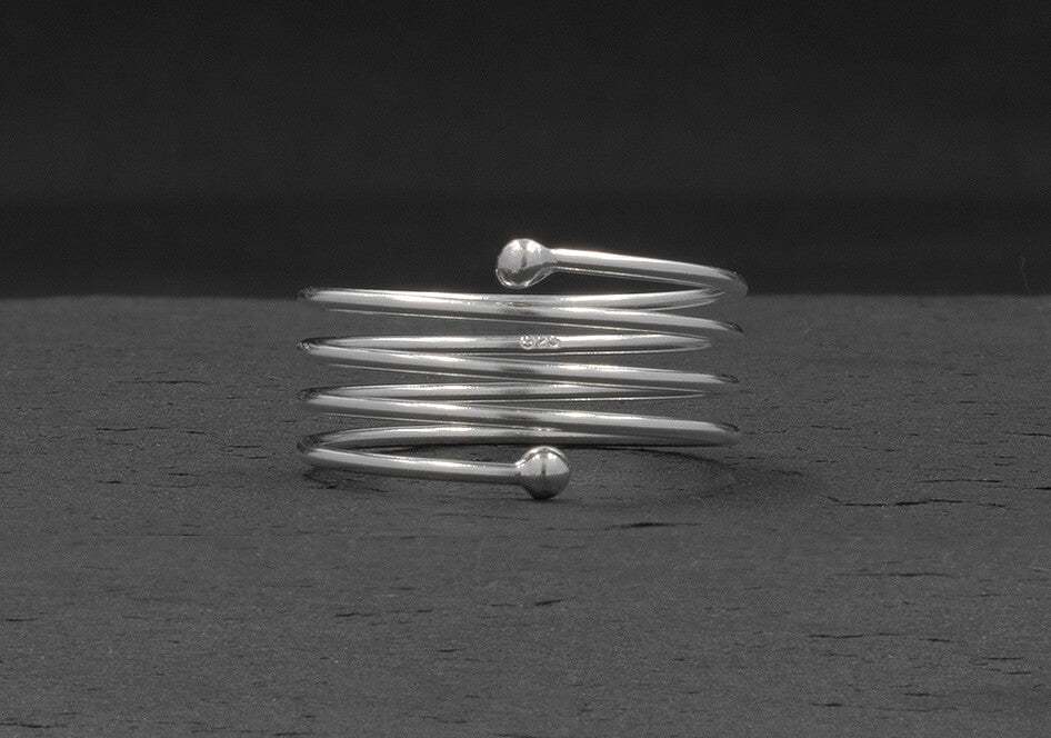 Side view of a coil silver ring from Hill to Street
