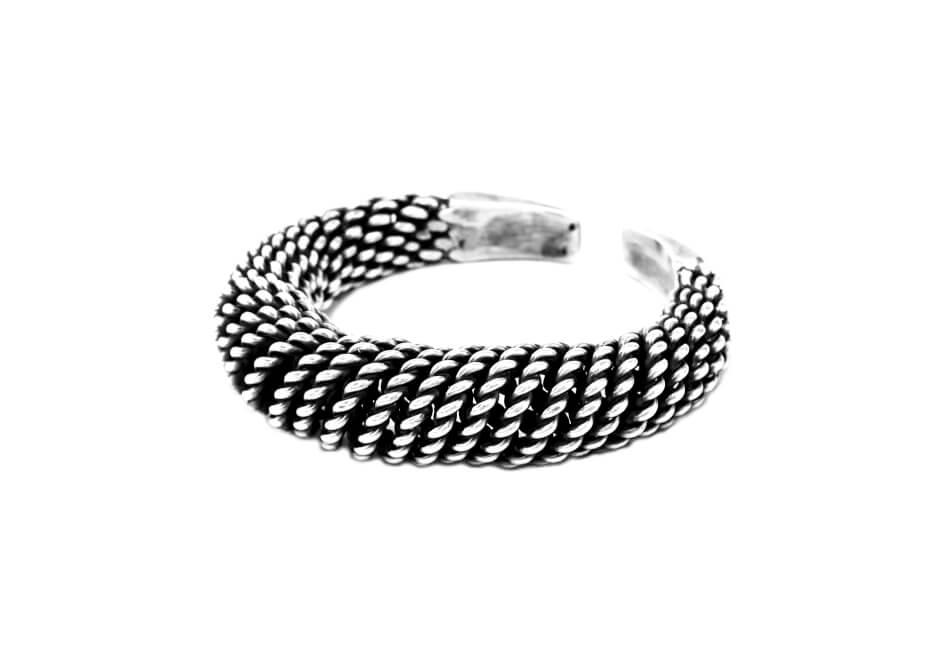 Hmong silver coil bangle from Hill to Street over a white background