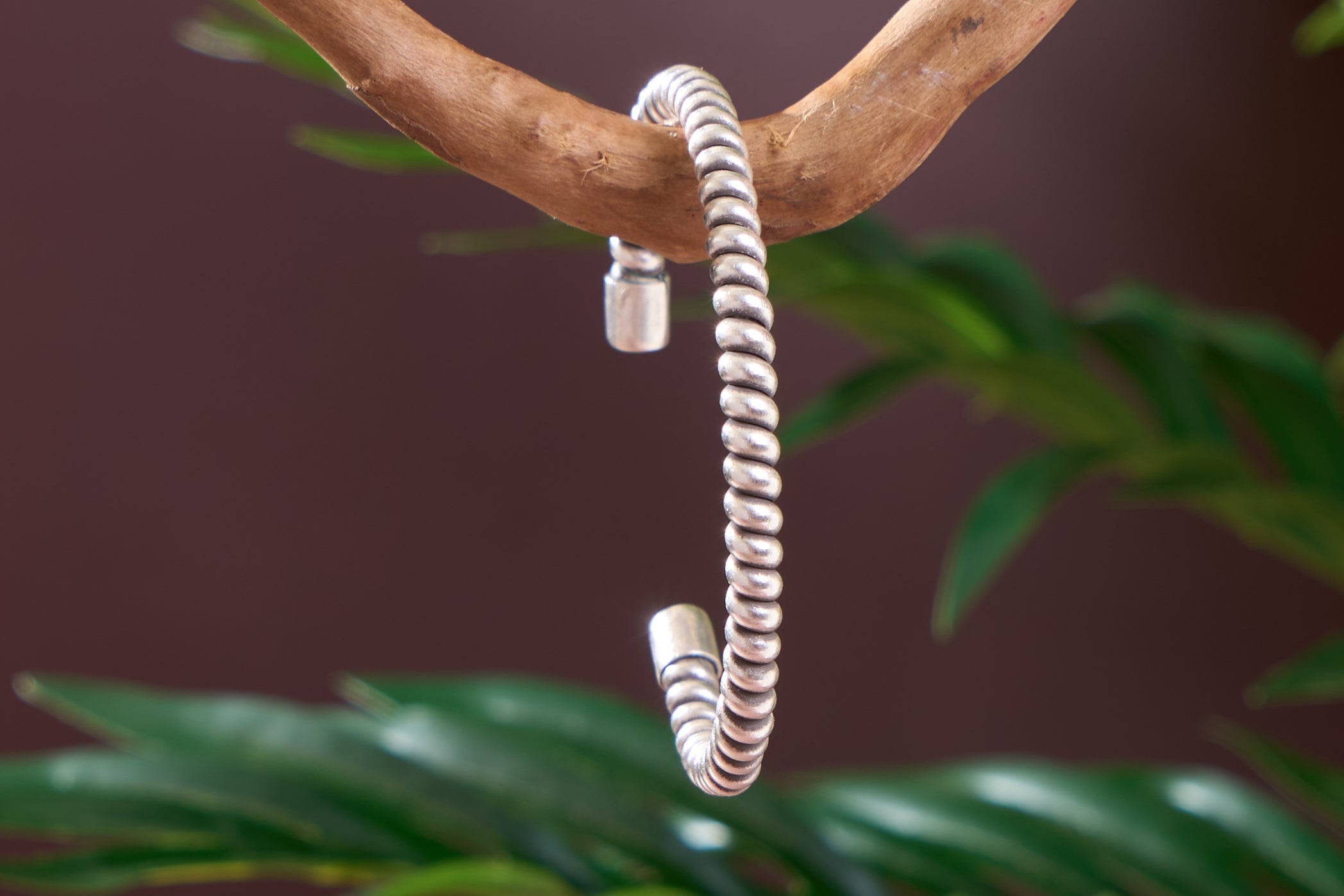 Close-up of spiral silver bead detail on the Naari pure silver bangle, handcrafted finish