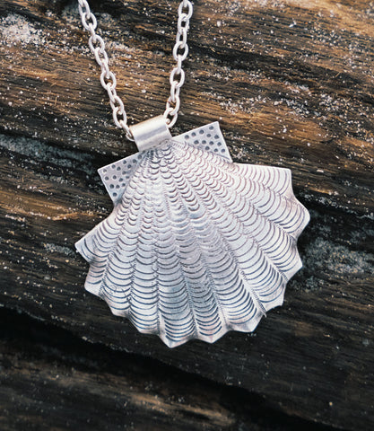 Close-up of the Amelia Necklace showing fine silverwork and shell motif detailing on a pure silver pendant