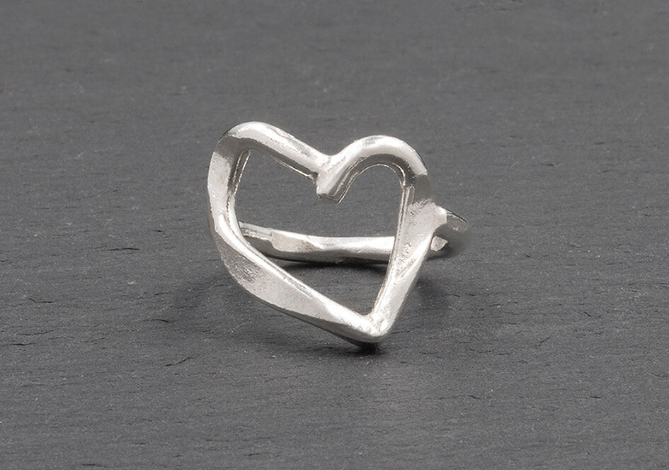 Close-up of Elara Pure Silver Heart Ring showing smooth fluid open-frame heart design and polished finish