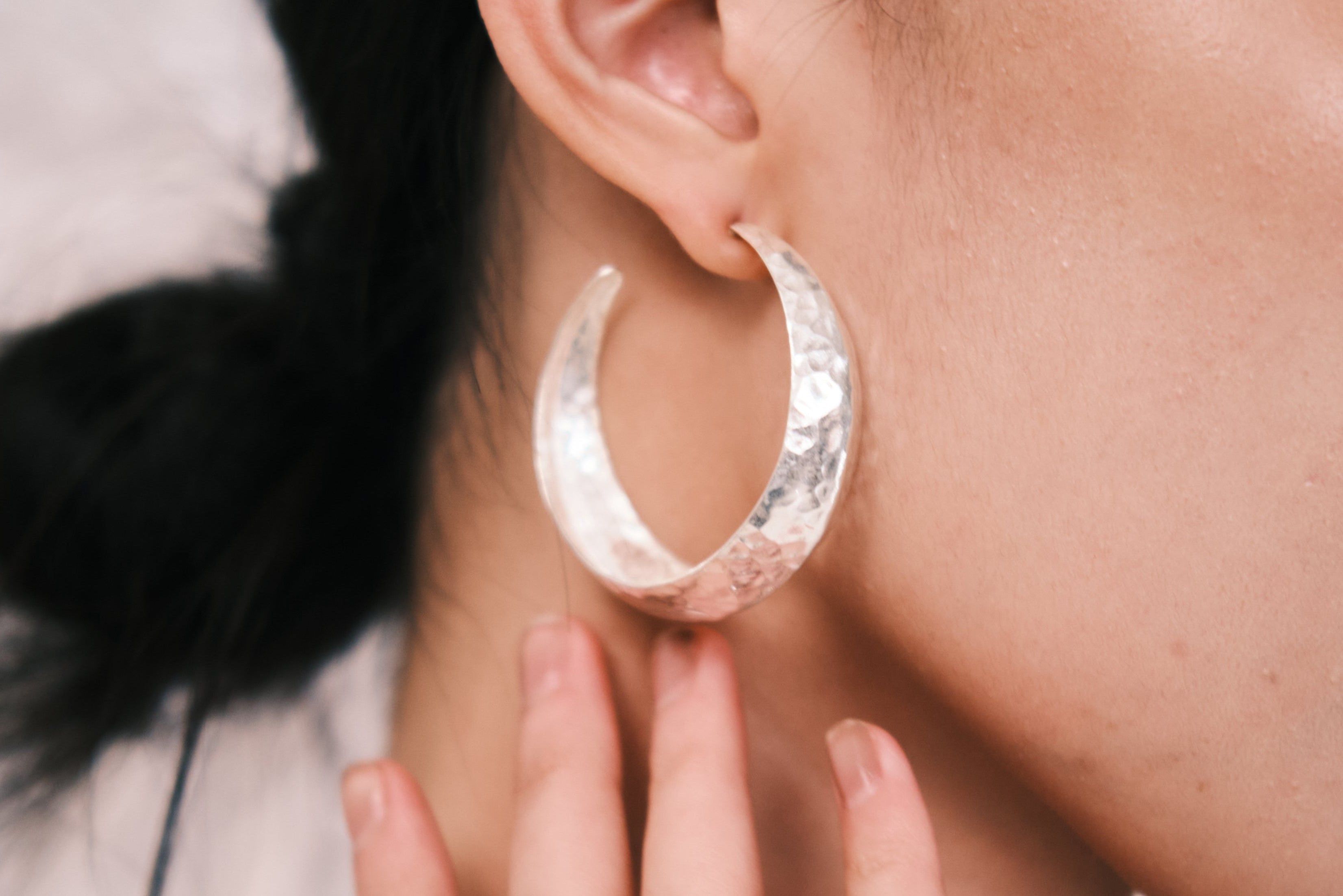 Helena Hoop pure silver earrings worn as a statement accessory for an elevated evening look
