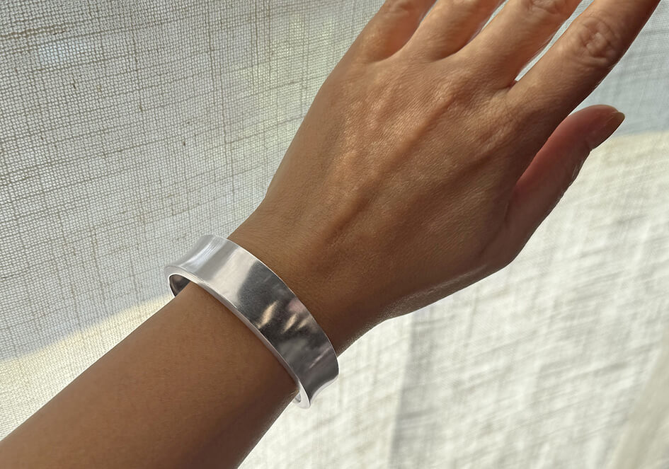 Jasmine pure silver bangle worn on wrist, styled for everyday casual and evening looks