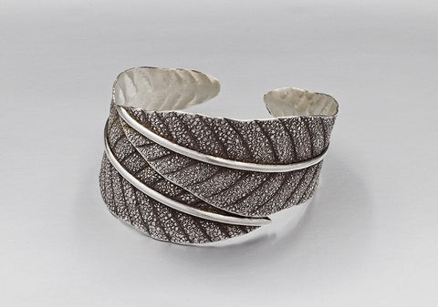 Close-up of oxidized pure silver leaf detail on the Leila Bangle showing handcrafted texture and depth