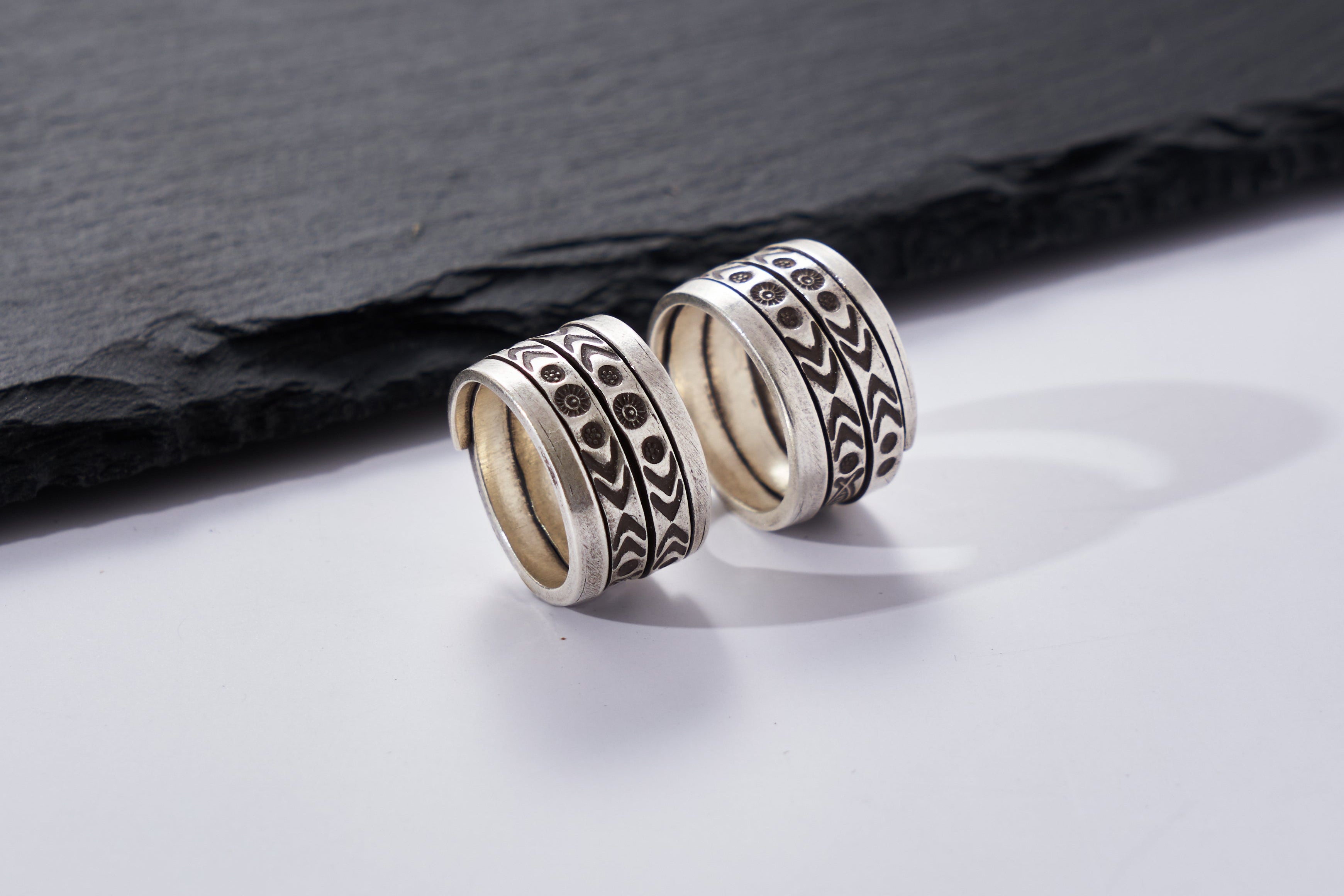 Close-up of Suvi Ring showing hand-etched tribal pattern detail on pure silver band