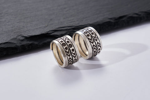 Close-up of Suvi Ring showing hand-etched tribal pattern detail on pure silver band