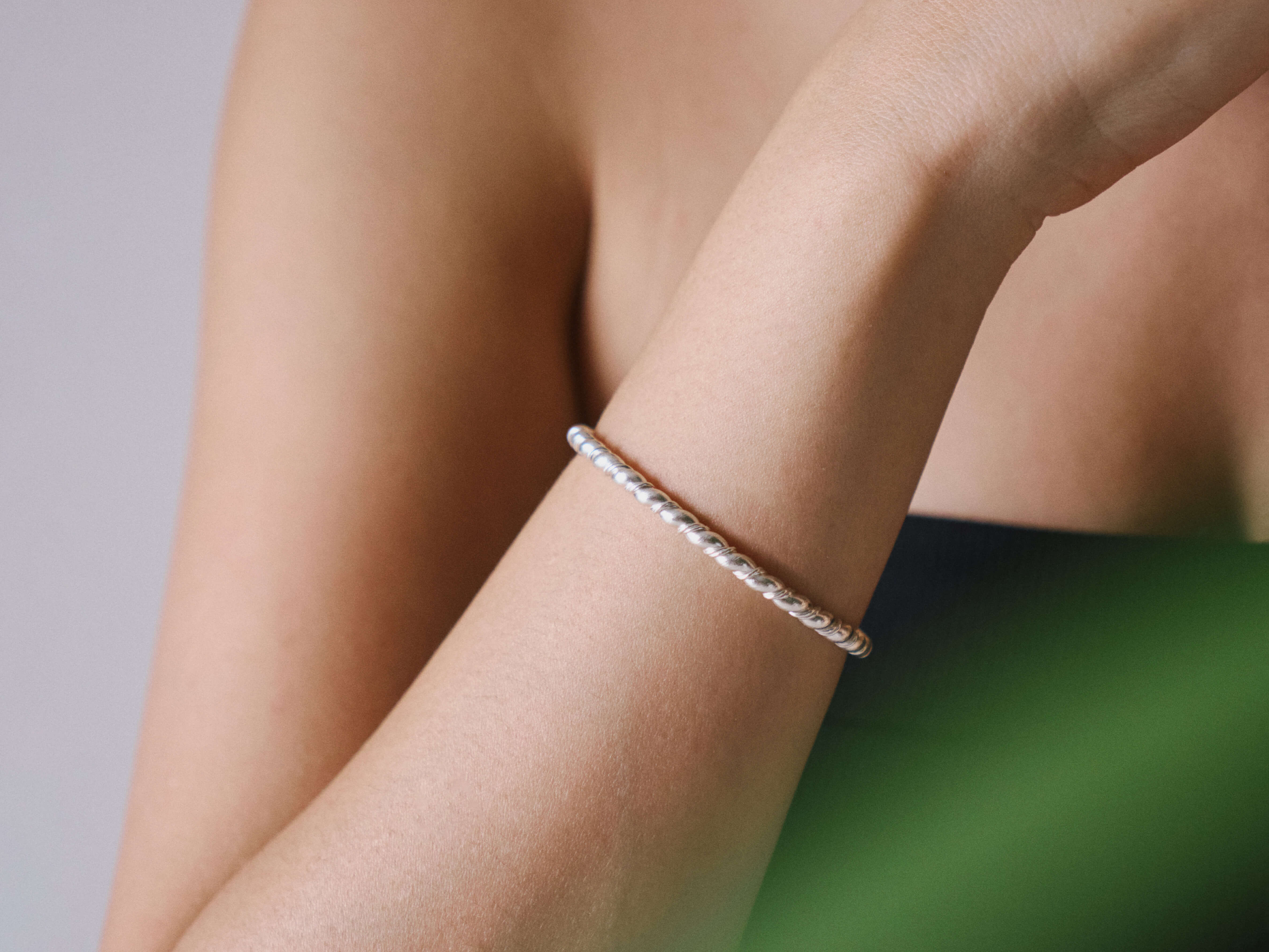Aire Bangle in pure silver showing smooth rounded form and open-ended design.