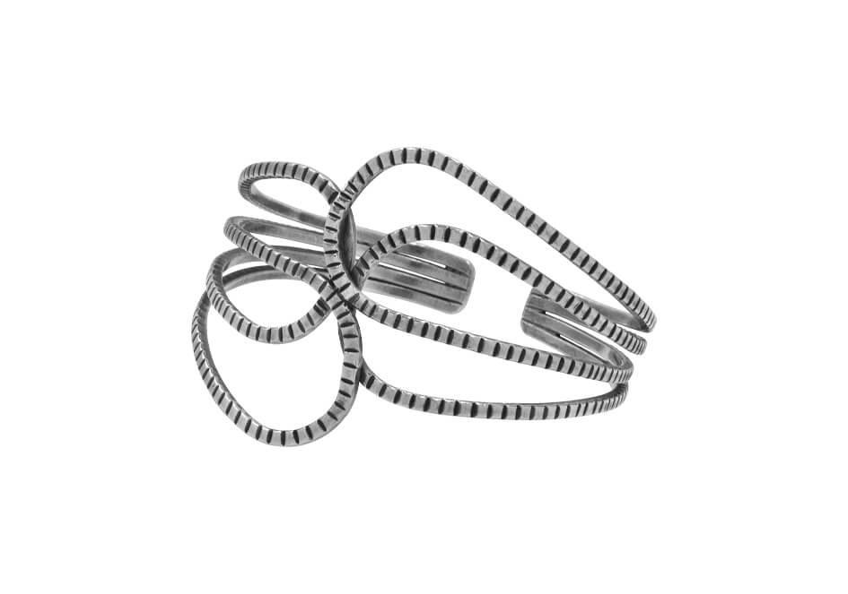 Close-up of the intertwined pure silver strands showcasing the handcrafted artisan finish.