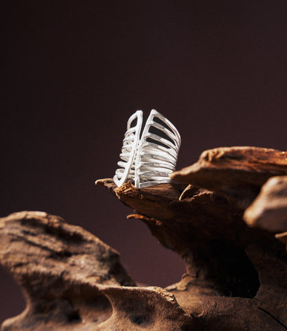 Eliana Ring in pure silver showing a lines design with hammered finish and wrap-style silhouette.