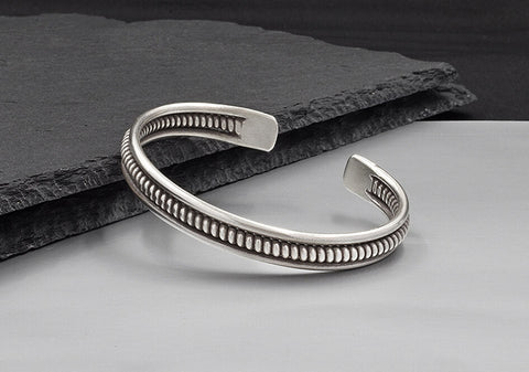 Close-up of coiled pure silver wire detailing on the Kian Bangle showing hand-finished texture and craftsmanship