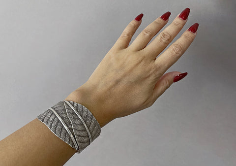 Model wearing the Leila Statement Cuff, a bold artisan pure silver bracelet for everyday styling.
