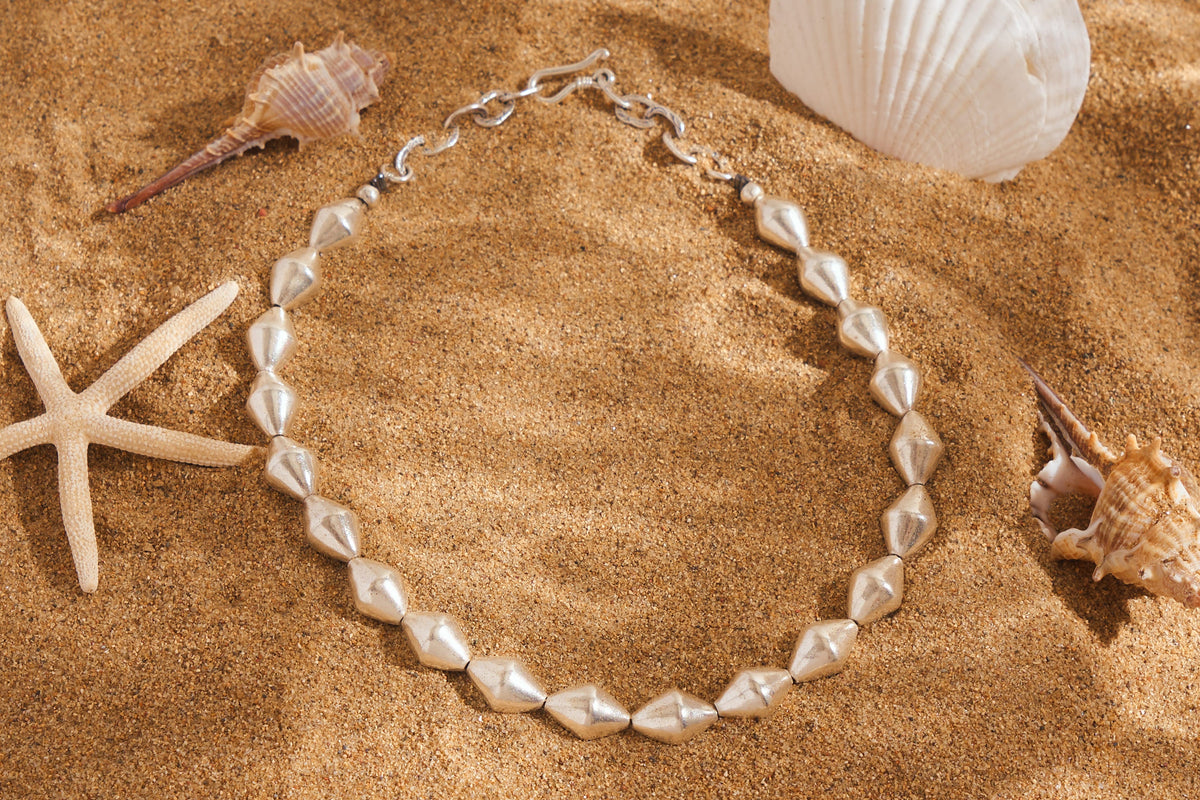 Handcrafted pure silver marquise bead necklace by Hill To Street, photographed from above
