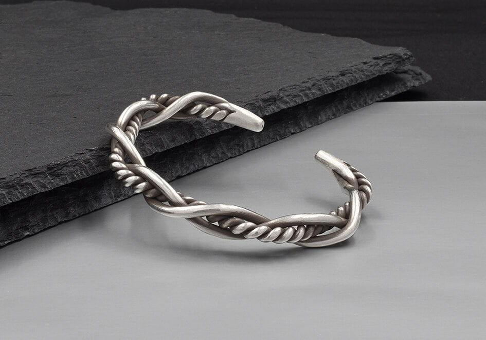 Close-up of Rowan Bangle showing contrasting smooth and twisted pure silver wire weave detail