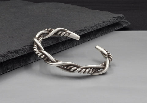 Close-up of Rowan Bangle showing contrasting smooth and twisted pure silver wire weave detail