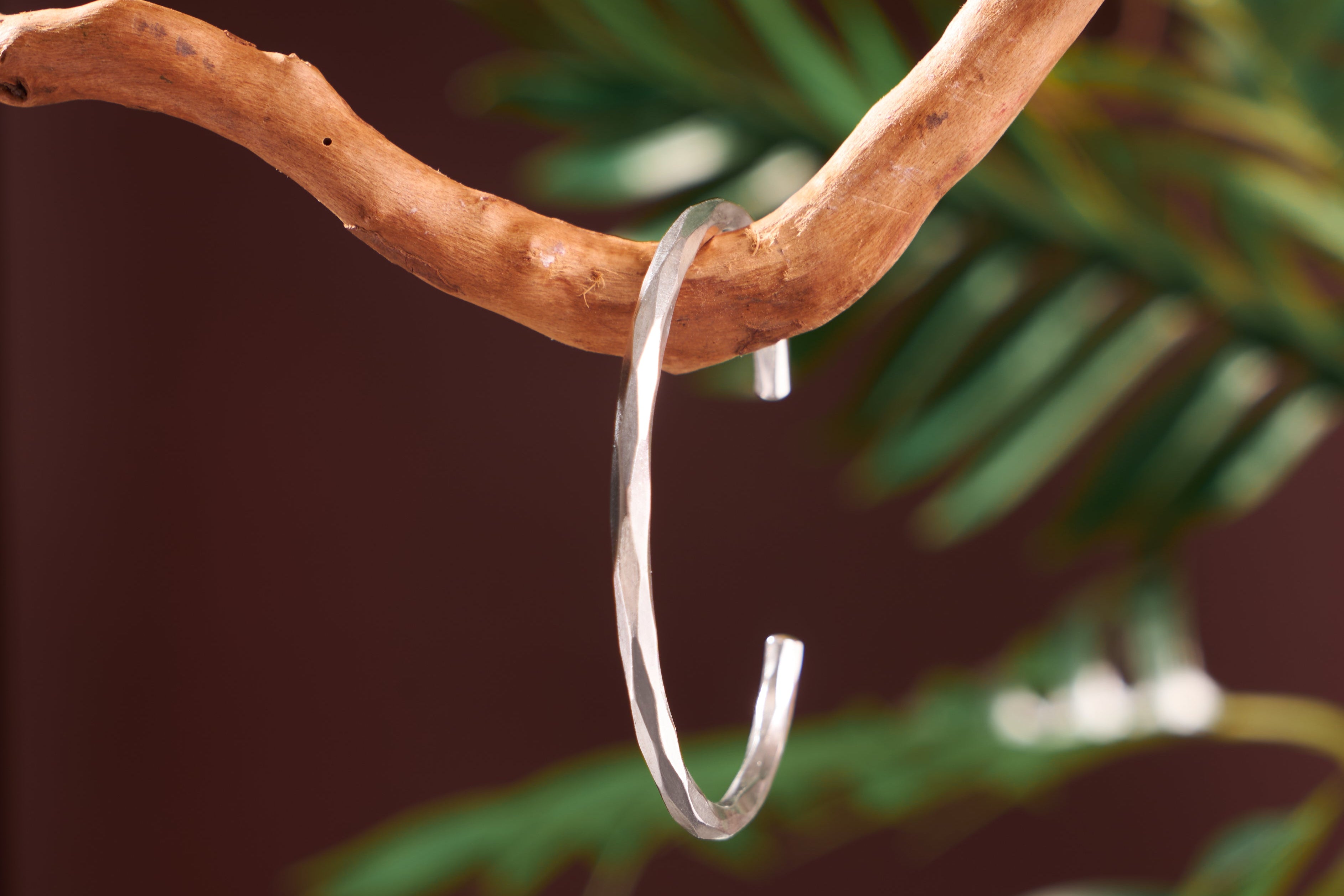 Close-up of wave-cut edge on Vera Bangle pure silver open cuff, showing hand-hammered texture
