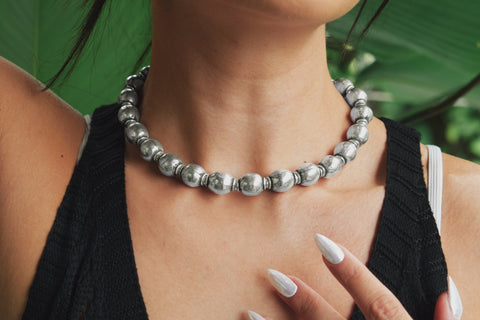 Zuma Necklace worn over a black linen shirt, showcasing its bold weight and street-inspired presence