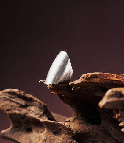 Zuri Statement Ring in pure silver showing a subtle evil eye motif and adjustable band.