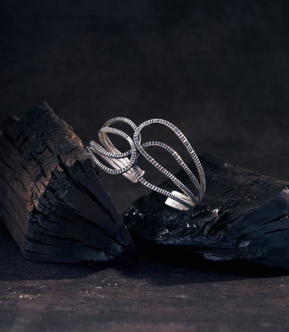 Alina Bangle - the intertwined pure silver strands showcasing the handcrafted artisan finish.