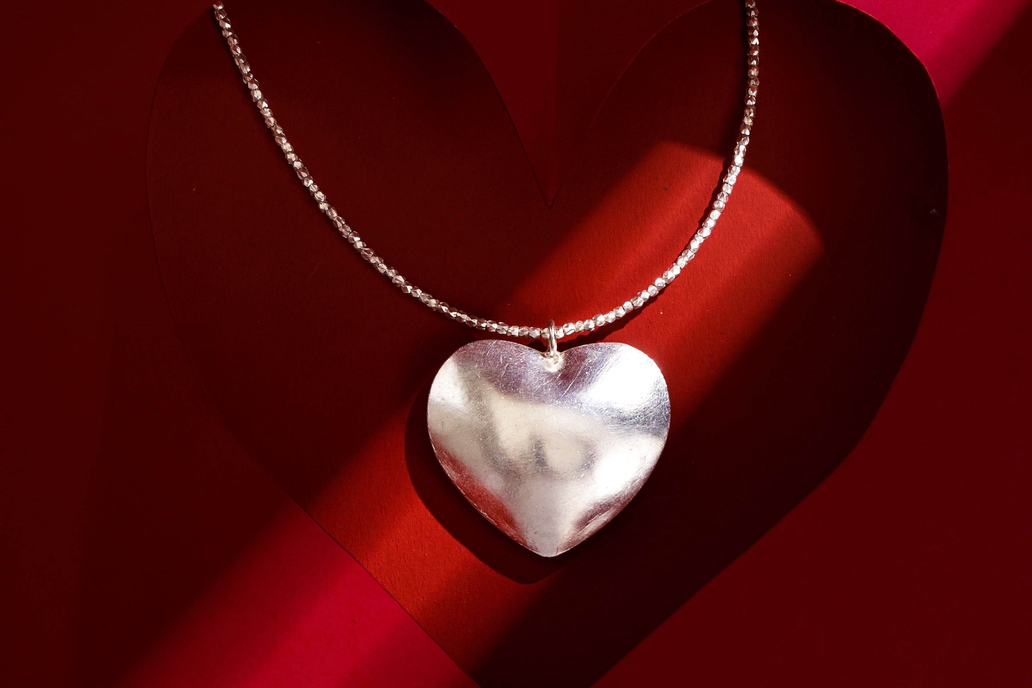 Amara Necklace in pure silver featuring a large polished heart-shaped pendant by Hill To Street