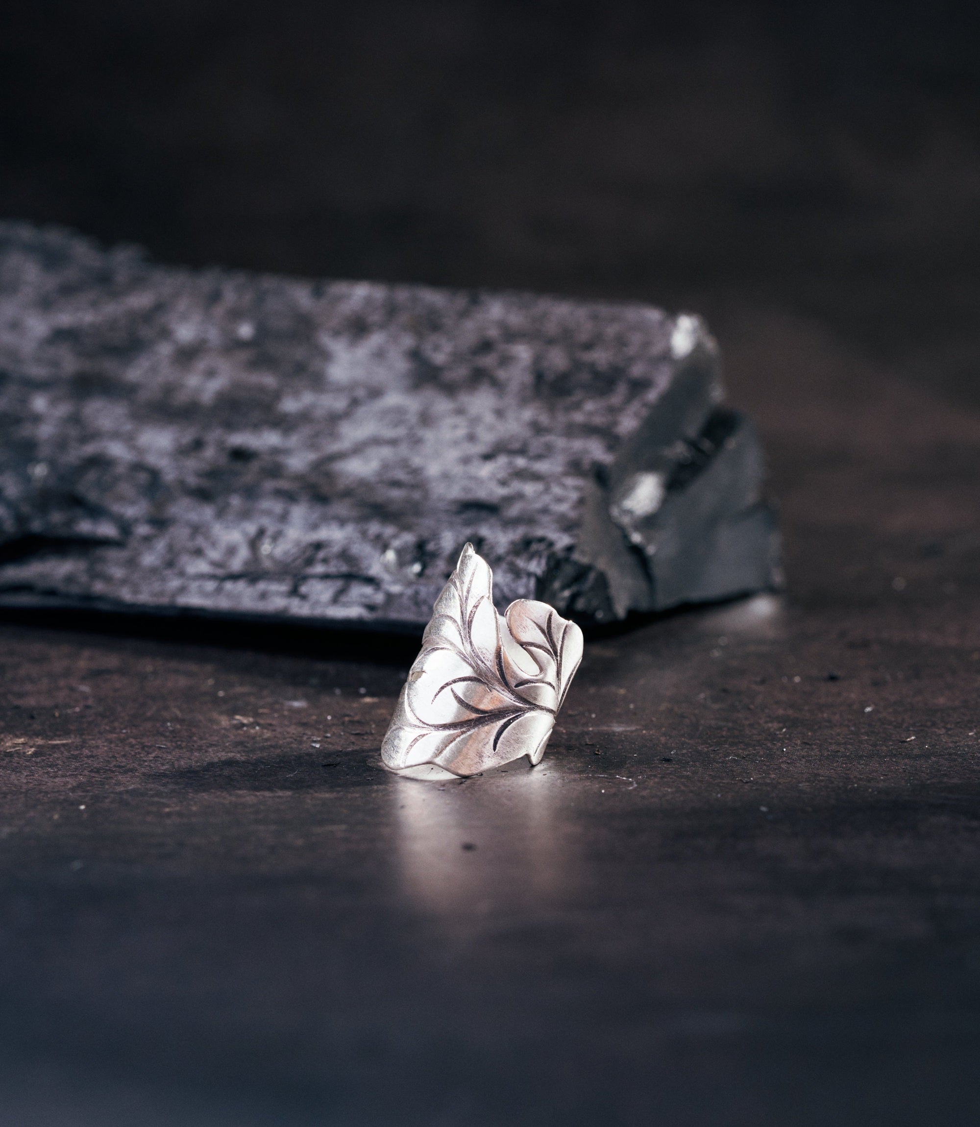 Anaya Ring in pure silver showing a wraparound leaf design curving around the finger.