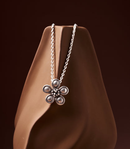 Briar Pure Silver Flower Pendant Necklace displayed on a jewellery bust, showing full pendant and rolo chain