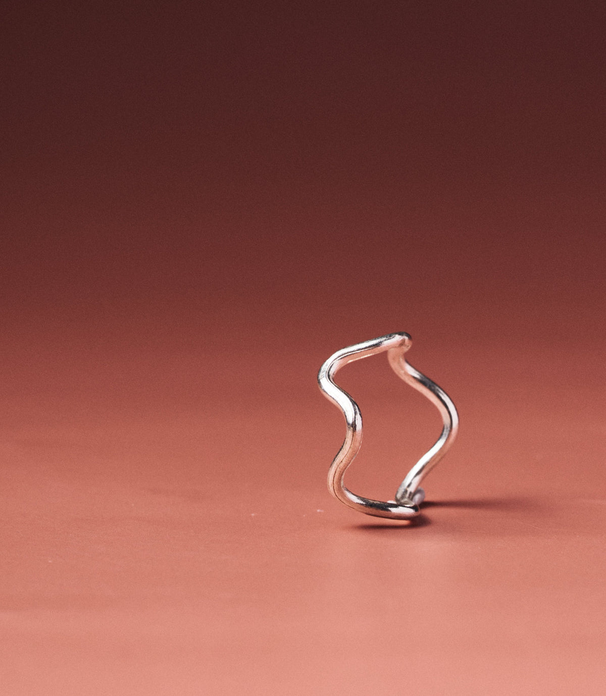 Celeste Pure Silver Wave Ring handcrafted from pure silver wire with a fluid wavy silhouette, front view