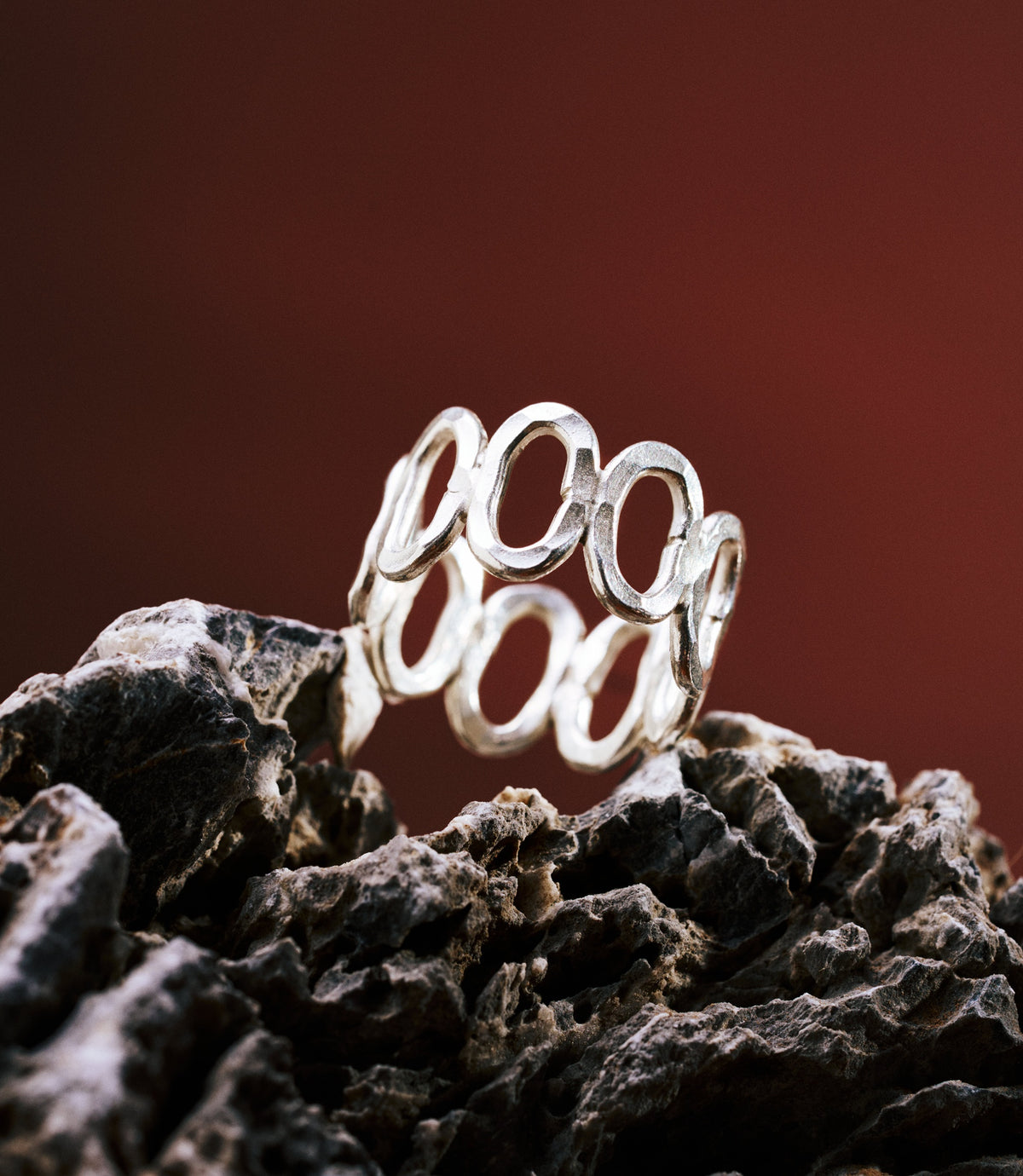 The Ember Ring in pure silver featuring an adjustable multi-circle design with a sculptural open band.