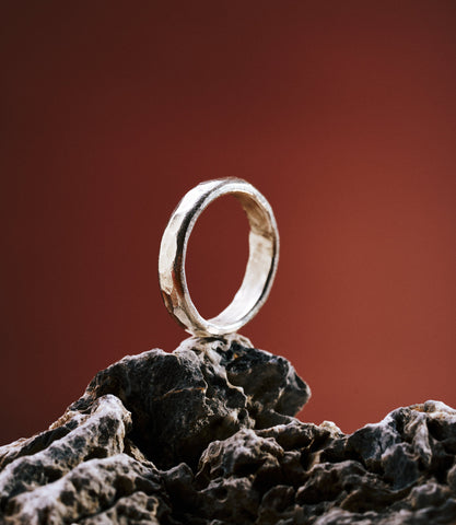 Kerry ring in pure silver showing a hand-hammered textured surface.