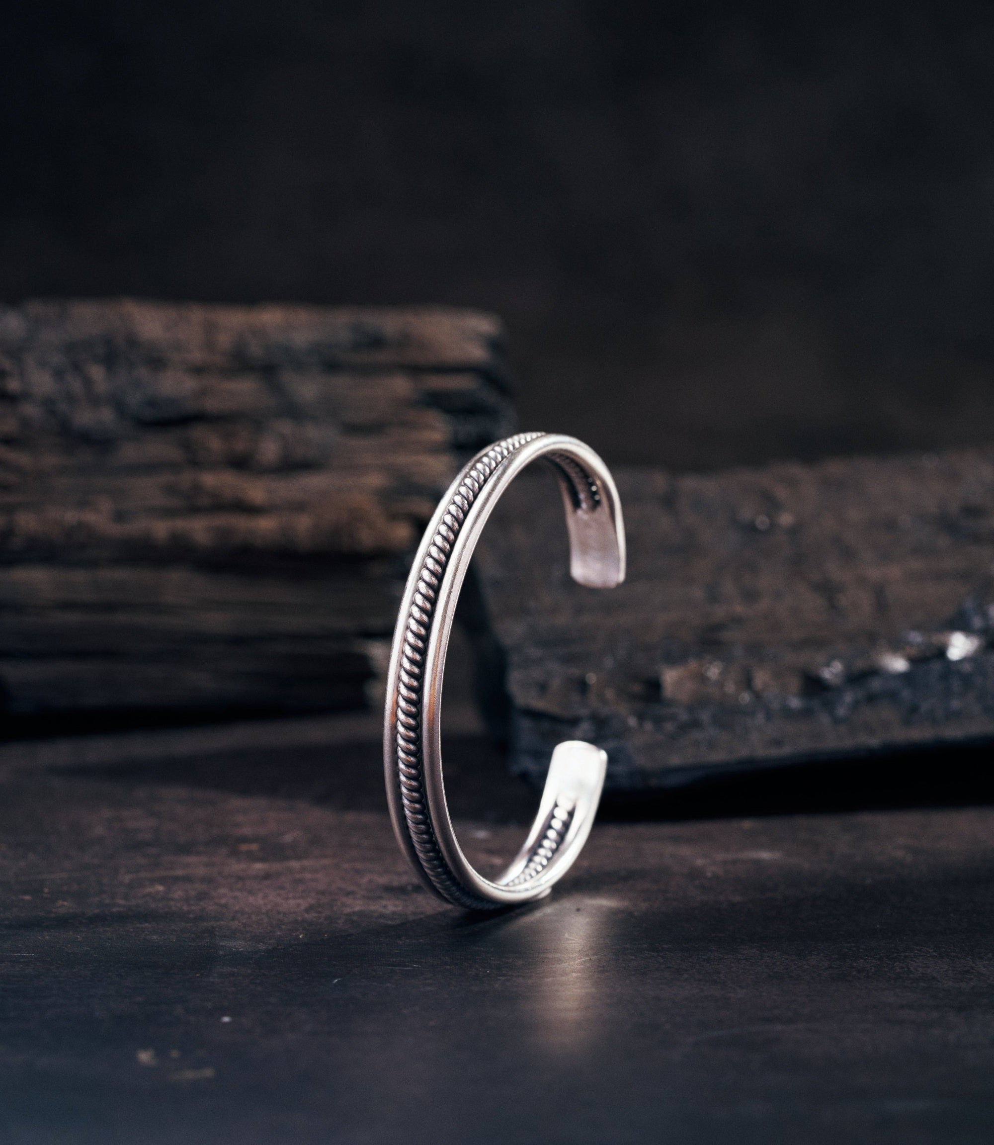 Kian Bangle handcrafted pure silver open cuff with smooth wire and intricately coiled detailing