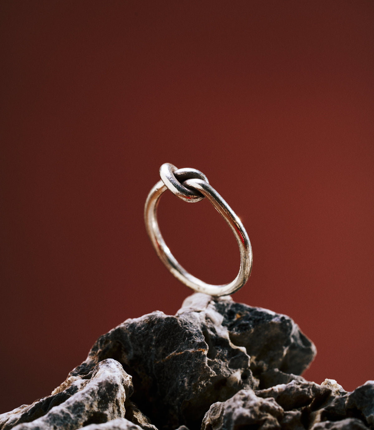 Minimalist Knot Ring in pure silver showing a delicate knot detail.