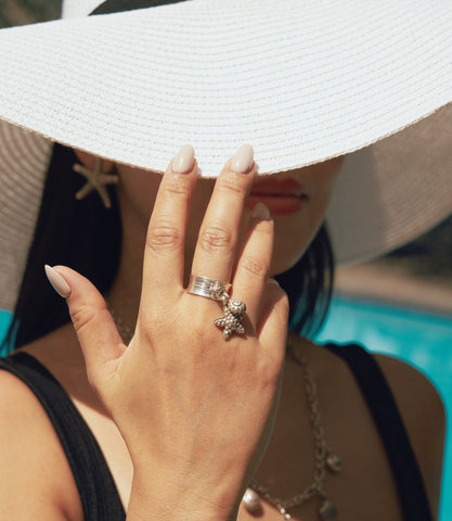 Model wearing the Nerina Charm Ring, a pure silver charm ring designed for effortless everyday styling.