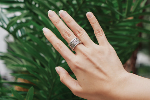 Suvi Ring worn on hand, stacked with other silver rings for an edgy layered look