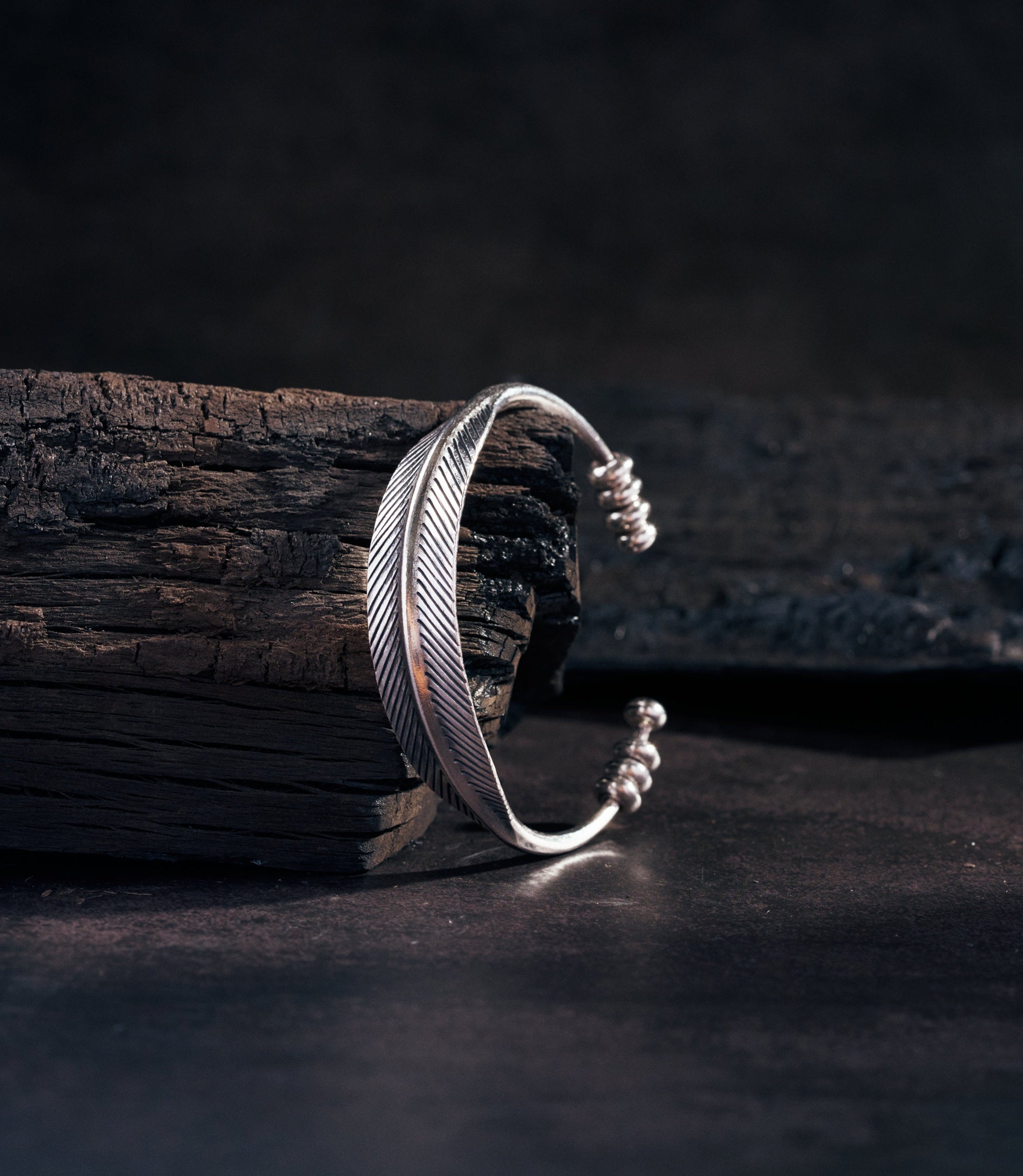 Pure silver bangle with botanical leaf details and open cuff silhouette — Sylvie Bangle by Hill to Street.